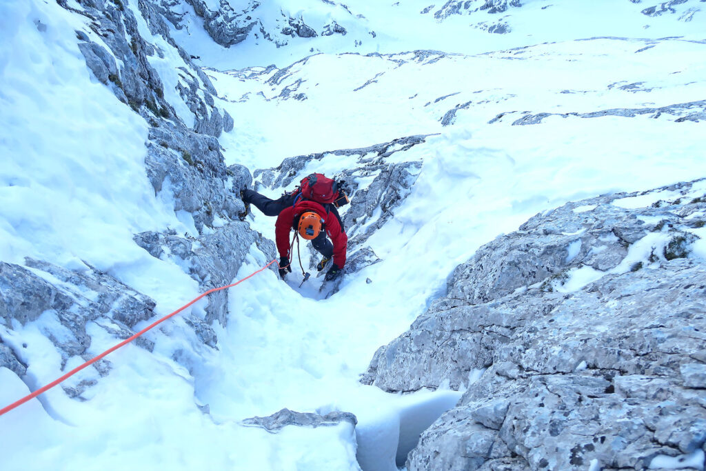 Slovenian route ascent in Triglav north wall in winter conditions with IFMGA guides
