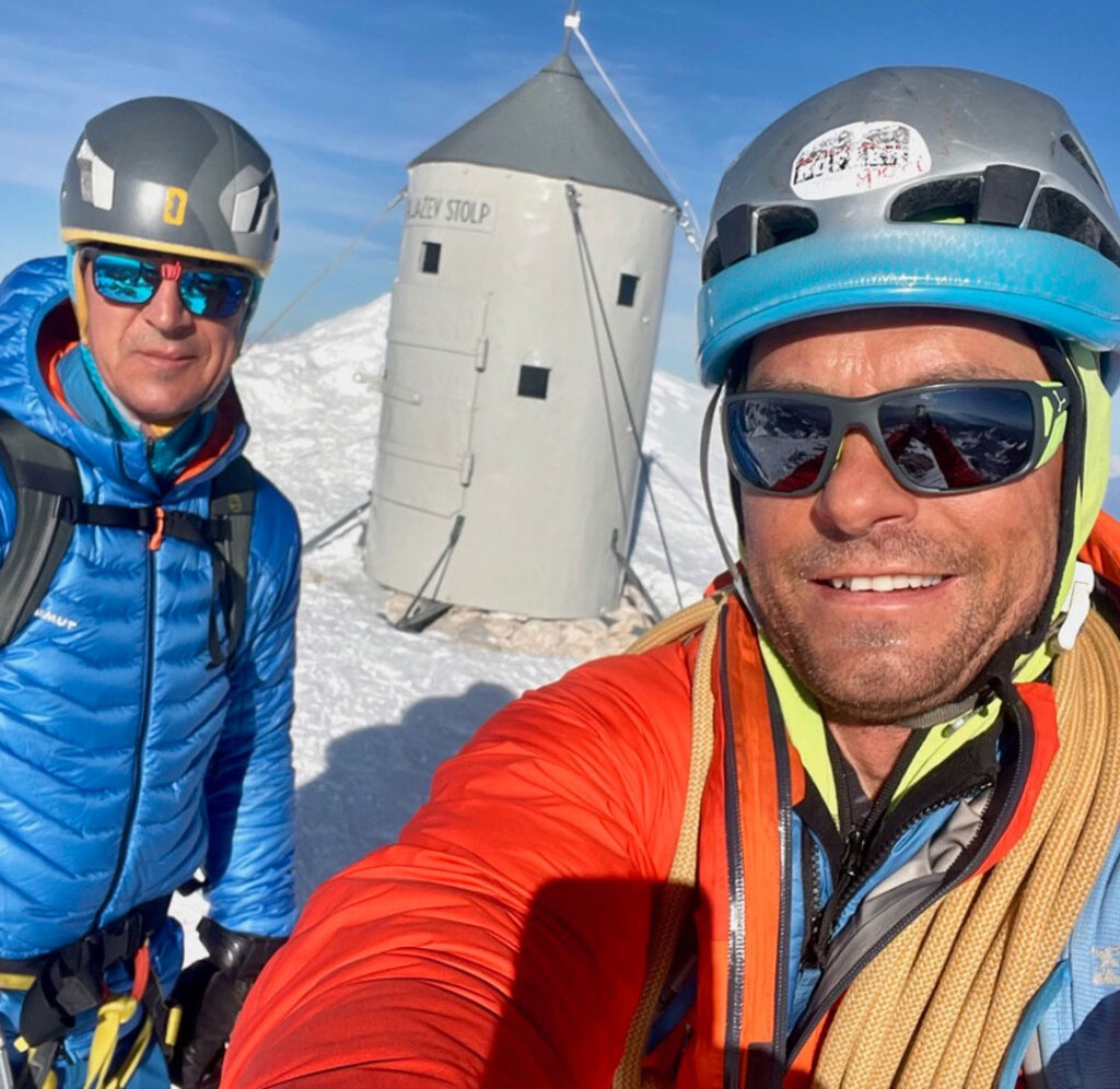 Kofler sport team - Grega Kofler himself on top of Triglav with Aljaž tower in the background on one of winter acends.